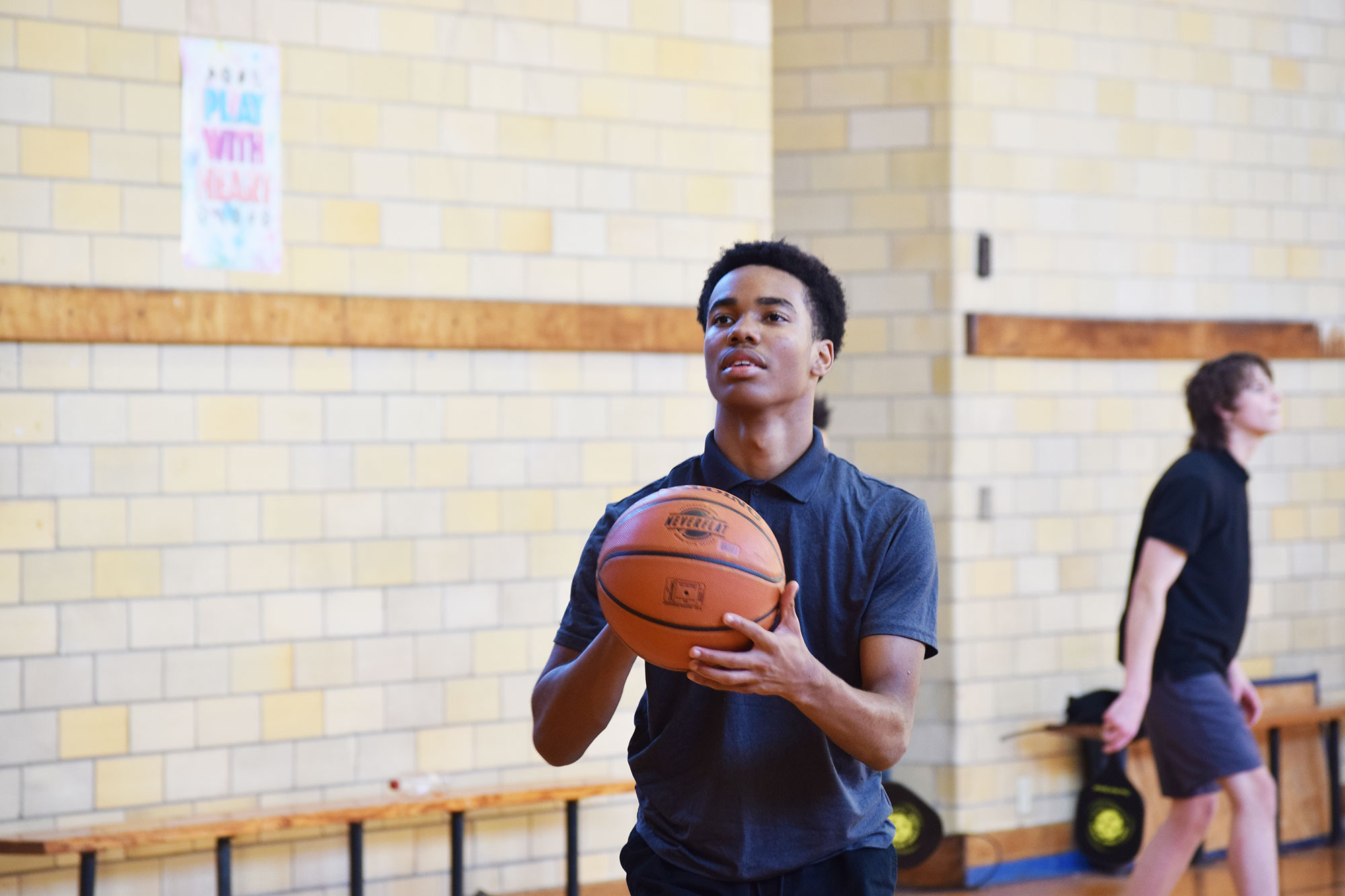 A student playing basketball